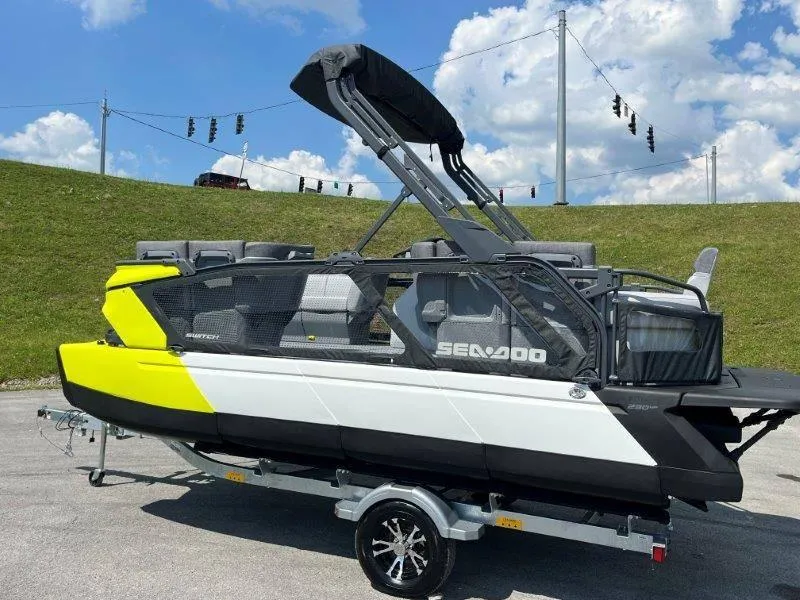 Slide: The Image of 2024 Sea-Doo Switch Cruise 18' 230hp boat on trailer, sunny day. - 43