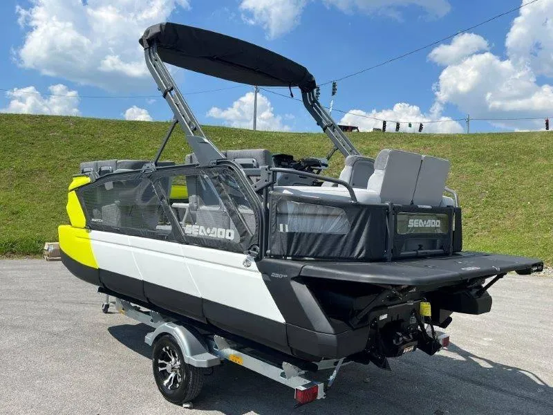 Slide: The Image of 2024 Sea-Doo Switch Cruise 18' 230hp pontoon boat on trailer, outdoors. - 49