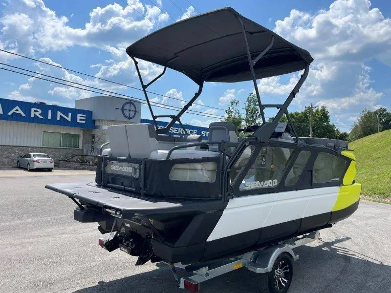 Slide: The Image of 2024 Sea-Doo Switch Cruise 18' 230hp boat with canopy, parked outdoors. - 6
