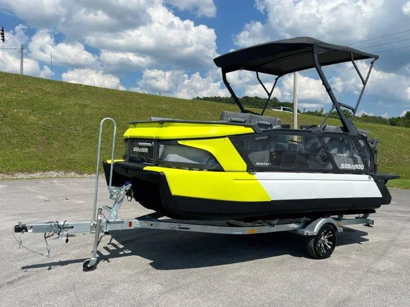 Slide: The Image of 2024 Sea-Doo Switch Cruise 18' 230hp on trailer, parked outdoors under blue sky. - 7