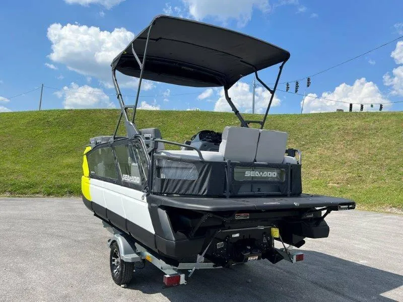 Slide: The Image of 2024 Sea-Doo Switch Cruise 18' 230hp boat on trailer, sunny day. - 9