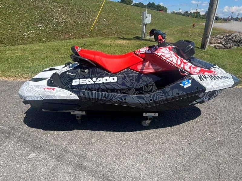 Slide: The Image of 2024 Sea-Doo Spark 1UP Trixx 90 Sound jet ski with vibrant red seat. - 15