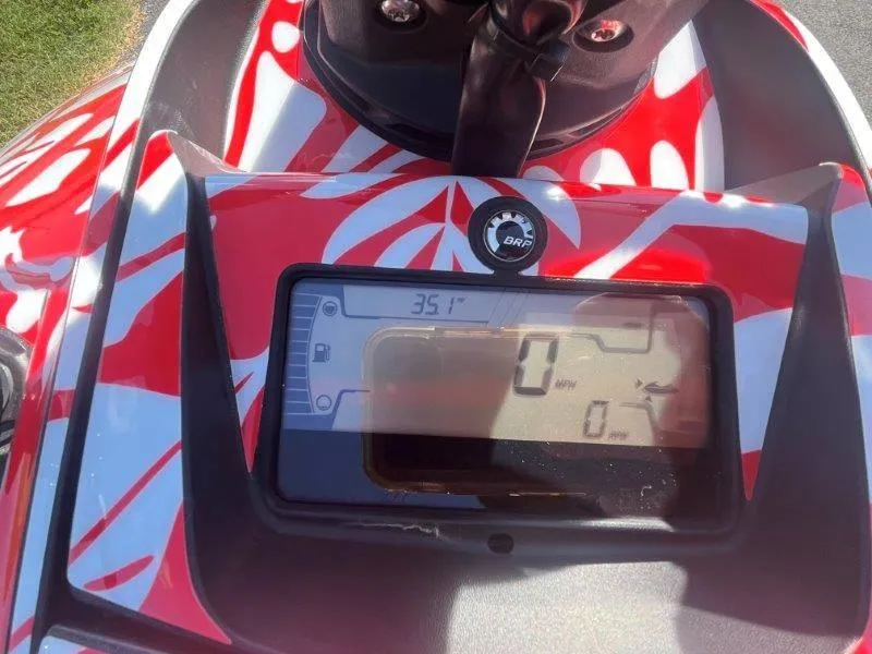 Slide: The Image of 2024 Sea-Doo Spark 1UP Trixx 90 Sound dashboard with vibrant red design. - 21