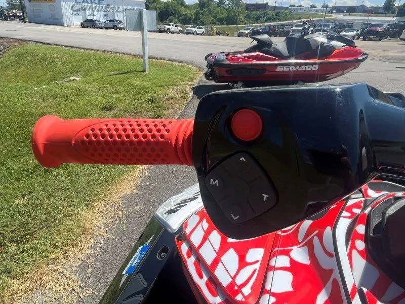 Slide: The Image of Close-up of 2024 Sea-Doo Spark 1UP Trixx 90 Sound handlebar with red grip. - 29