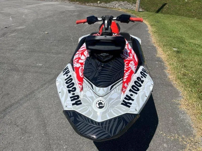 Slide: The Image of 2024 Sea-Doo Spark 1UP Trixx 90 Sound jet ski on pavement. - 7
