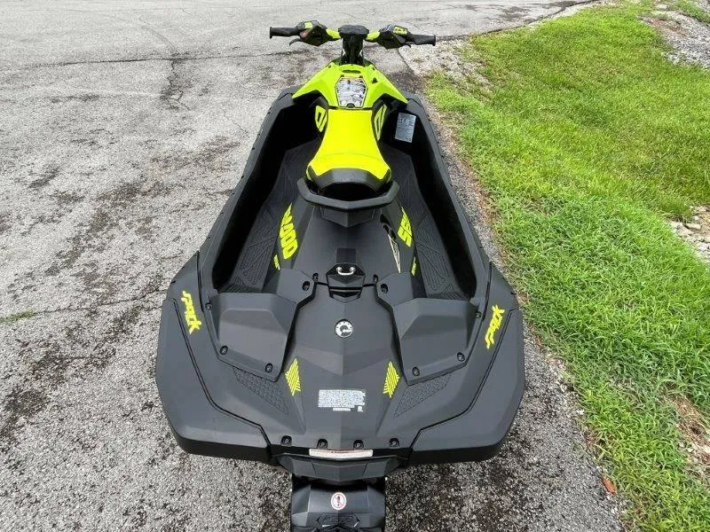 Slide: The Image of 2023 Sea-Doo SPARK TRIXX 2up jet ski on pavement near grass. - 10