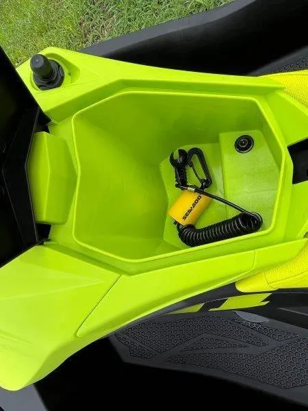 Slide: The Image of 2023 Sea-Doo SPARK TRIXX 2up storage compartment with safety lanyard. - 12
