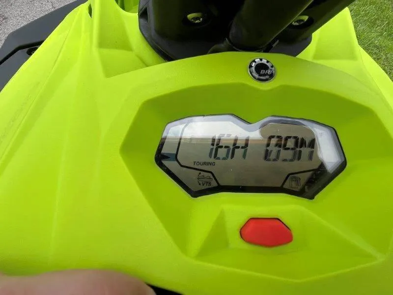 Slide: The Image of 2023 Sea-Doo SPARK TRIXX 2up dashboard display, vibrant green color. - 13