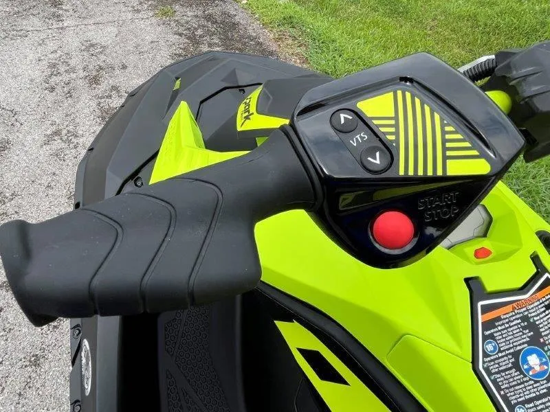 Slide: The Image of Close-up of 2023 Sea-Doo SPARK TRIXX 2up handlebar controls, featuring vibrant yellow design. - 15