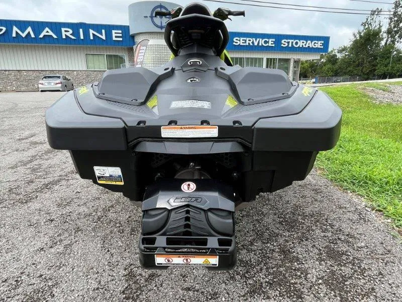 Slide: The Image of 2023 Sea-Doo SPARK TRIXX 2up jet ski rear view at dealership. - 5