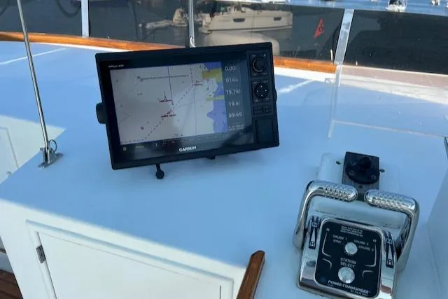 Slide: The Image of Garmin navigation system on 1980 Huckins Sports Cruiser boat dashboard. - 15