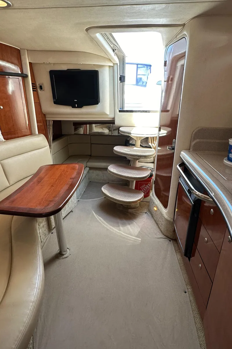 Slide: The Image of Interior of 2007 Sea Ray 320 Sundancer yacht with modern amenities and elegant design. - 33