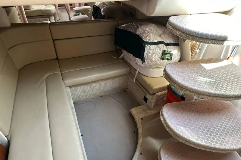 Slide: The Image of Interior of 2007 Sea Ray 320 Sundancer with beige seating and spiral staircase. - 35
