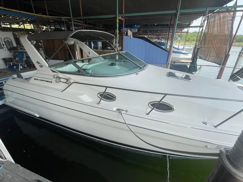The Image of 1997 Wellcraft 3200 Martinique boat docked in marina. - 1