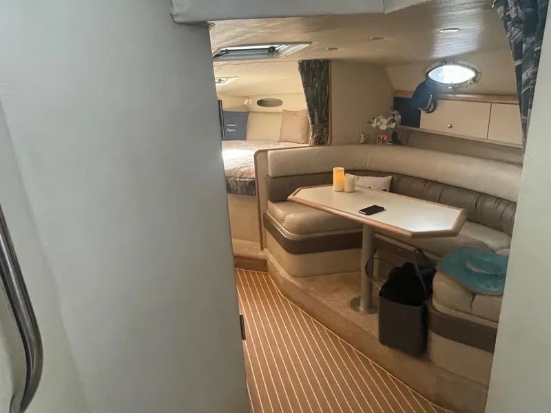 Slide: The Image of Interior of 1997 Wellcraft 3200 Martinique yacht with cozy seating and table. - 5