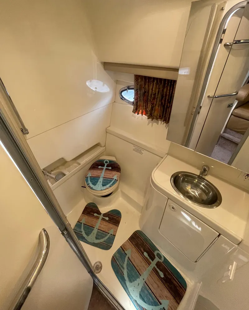 Slide: The Image of 1999 Formula 34 PC yacht bathroom with nautical-themed decor and compact design. - 21