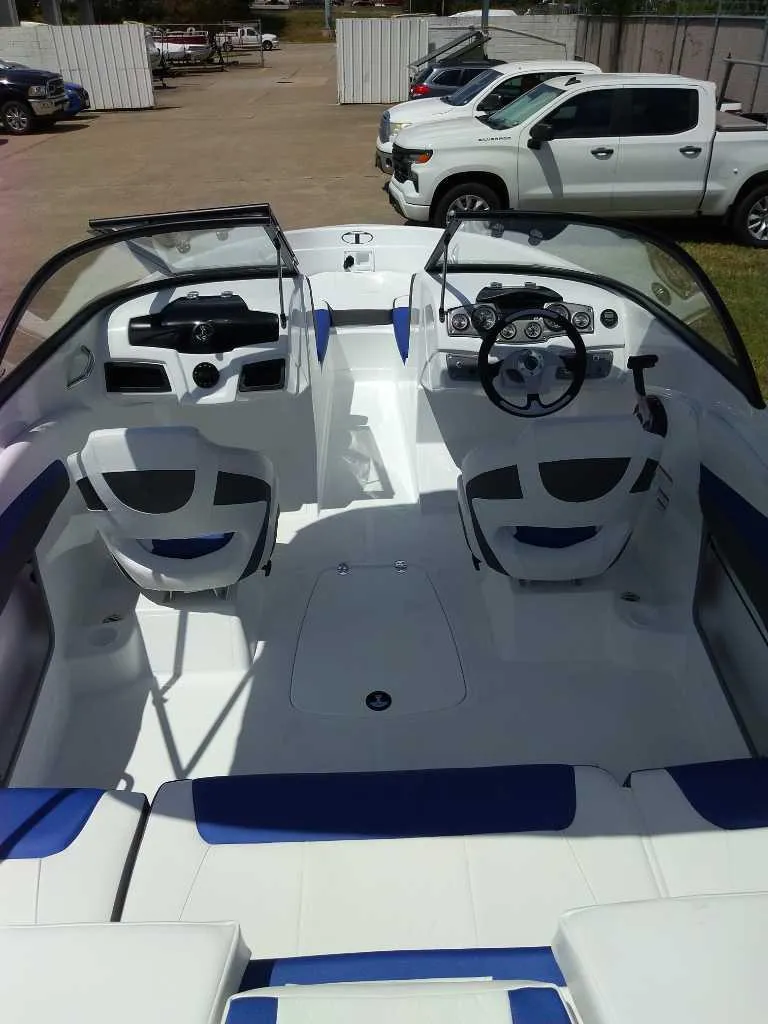 Slide: The Image of 2024 Tahoe 200 S boat interior with modern seating and steering wheel. - 4