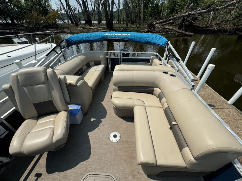 Slide: The Image of 2020 Sun Tracker Party Barge 22 Tri Toon RF XP3 with beige seating on a calm lake. - 12