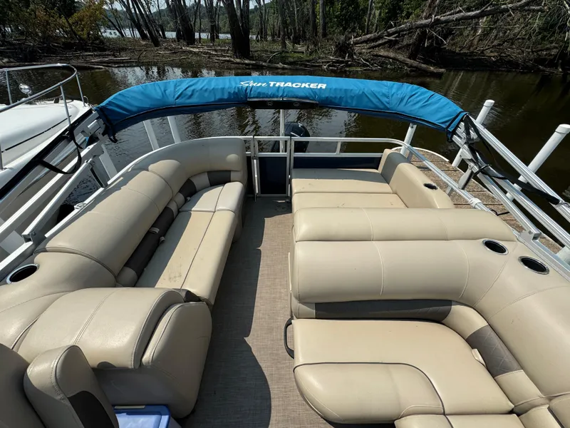 Slide: The Image of 2020 Sun Tracker Party Barge 22 Tri Toon RF XP3 with beige seating and blue canopy. - 13