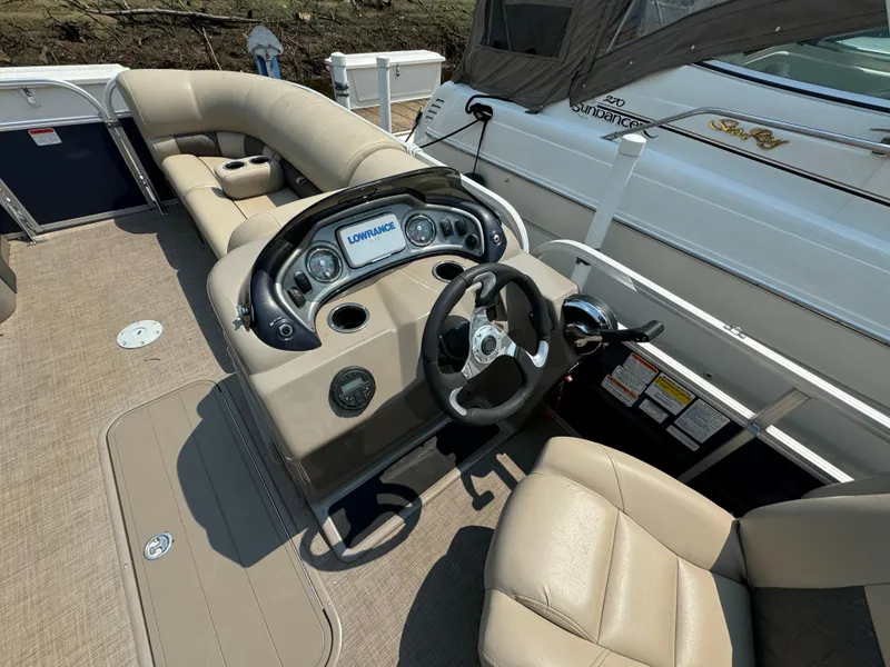 Slide: The Image of 2020 Sun Tracker Party Barge 22 Tri Toon RF XP3 interior with steering console and seating. - 16