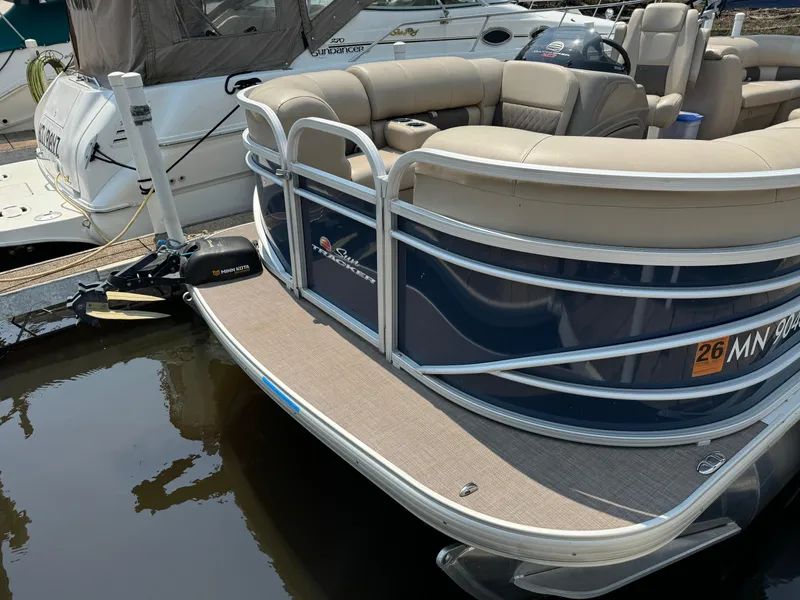 Slide: The Image of 2020 Sun Tracker Party Barge 22 Tri Toon RF XP3 docked, featuring spacious seating. - 2