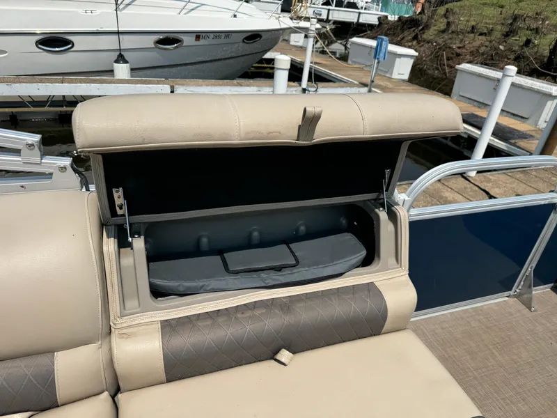 Slide: The Image of 2020 Sun Tracker Party Barge 22 Tri Toon RF XP3 with open storage compartment on deck. - 24