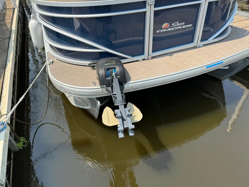 Slide: The Image of 2020 Sun Tracker Party Barge 22 Tri Toon RF XP3 docked, rear view with motor. - 3