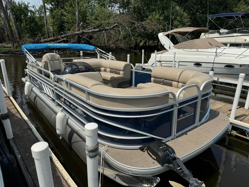 Slide: The Image of 2020 Sun Tracker Party Barge 22 Tri Toon RF XP3 docked, featuring spacious seating and canopy. - 4