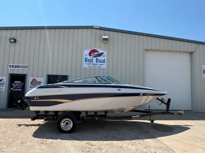 Slide: The Image of 2001 Crownline 192 BR boat on trailer outside Boji Boat Brokers building. - 0