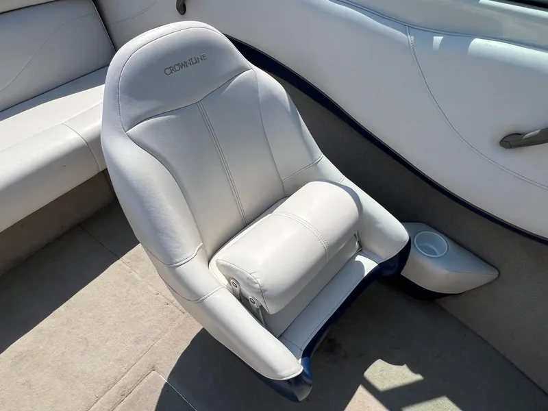 Slide: The Image of 2001 Crownline 192 BR boat interior with white cushioned seating. - 13