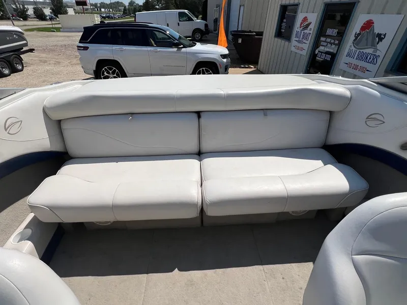 Slide: The Image of 2001 Crownline 192 BR boat interior with white cushioned seating. - 14