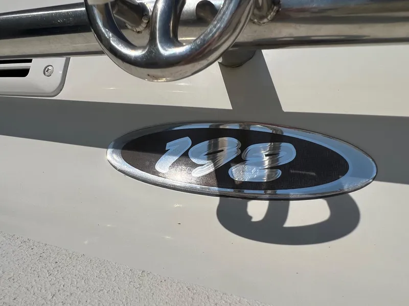 Slide: The Image of 2001 Crownline 192 BR boat emblem with chrome detailing. - 2