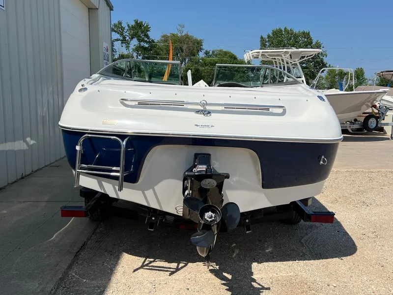 Slide: The Image of 2001 Crownline 192 BR boat, rear view, parked outdoors on a sunny day. - 5