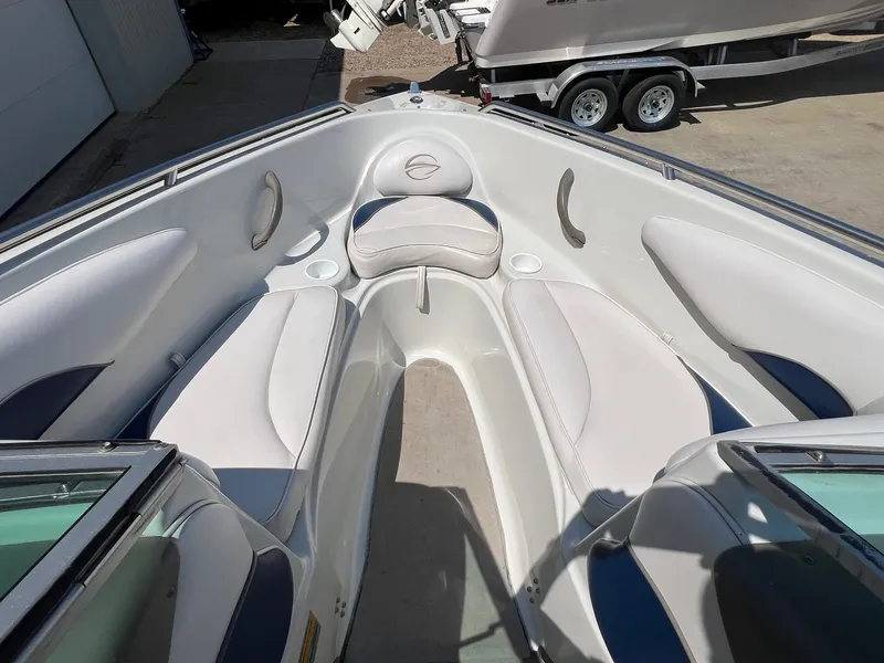 Slide: The Image of 2001 Crownline 192 BR boat interior with white seating and cup holders. - 7
