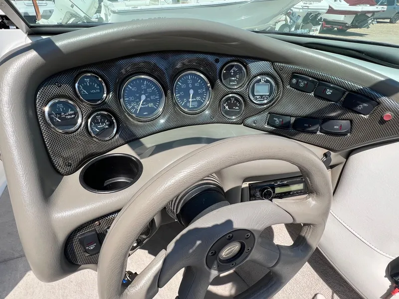 Slide: The Image of Dashboard of a 2001 Crownline 192 BR boat with gauges and controls. - 9