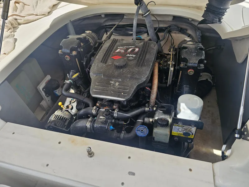 Slide: The Image of Engine compartment of a 2007 Monterey 220 EX boat, featuring a MerCruiser engine. - 15