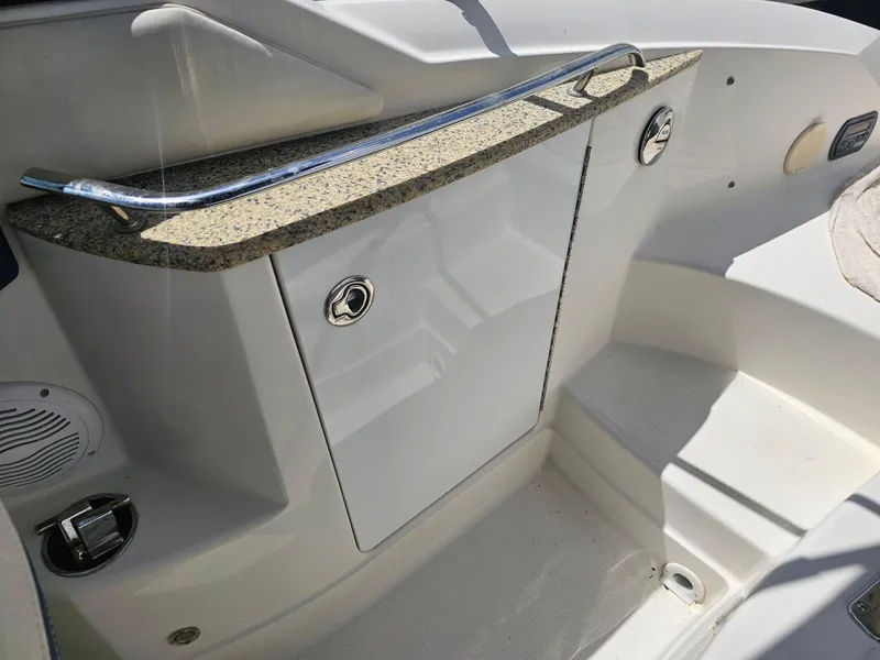 Slide: The Image of 2007 Monterey 220 EX boat interior with storage compartment and sleek design. - 17