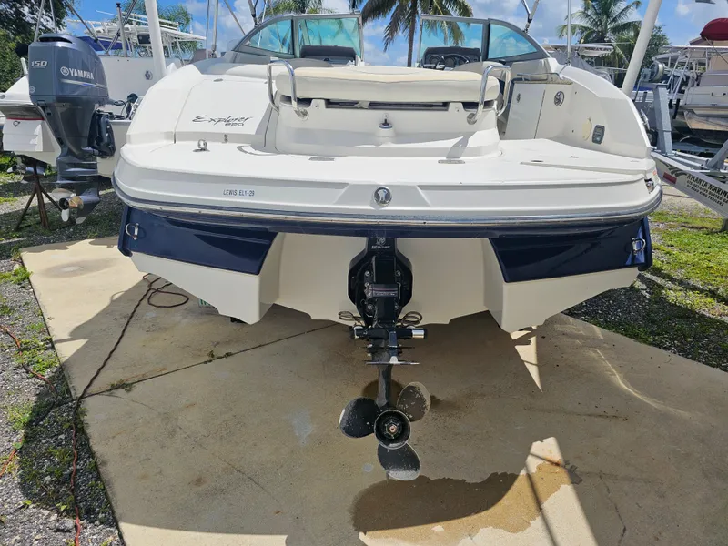 Slide: The Image of 2007 Monterey 220 EX boat, rear view with outboard motor, parked on concrete. - 22