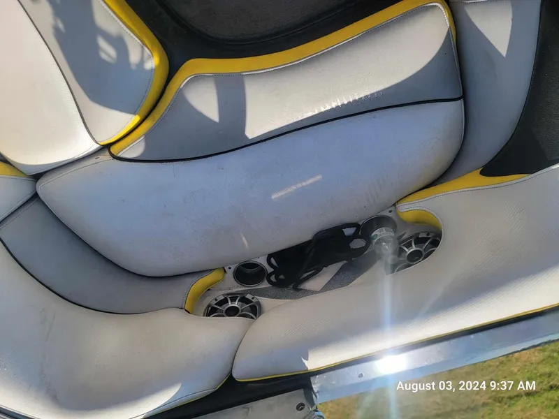 Slide: The Image of Interior of 2013 MB F21 Tomcat boat with yellow-accented seating. - 10