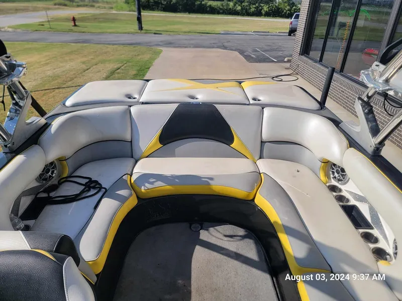 Slide: The Image of 2013 MB F21 Tomcat boat interior with yellow and gray seating, photographed on August 3, 2024. - 11