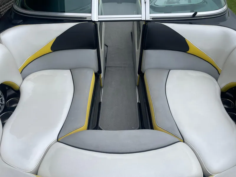 Slide: The Image of Interior seating of 2013 MB F21 Tomcat boat with white, gray, and yellow upholstery. - 21