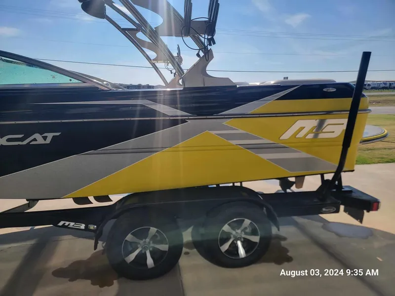 Slide: The Image of Yellow and black MB F21 Tomcat boat on trailer, photographed on August 3, 2024. - 3