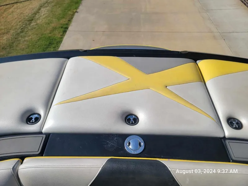 Slide: The Image of Rear view of 2013 MB F21 Tomcat boat with yellow and gray upholstery. - 7