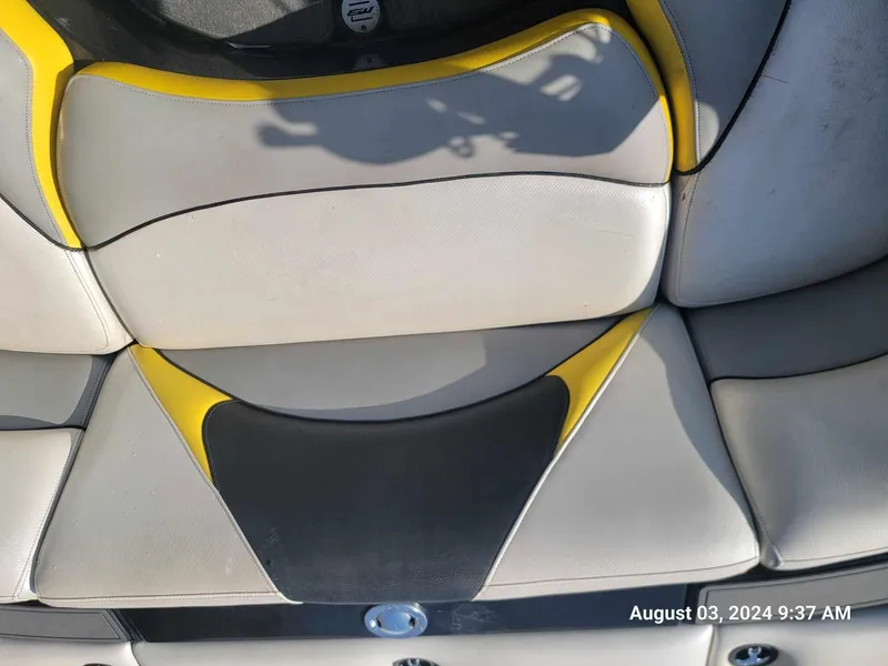 Slide: The Image of Interior seating of 2013 MB F21 Tomcat boat with yellow and black accents. - 9