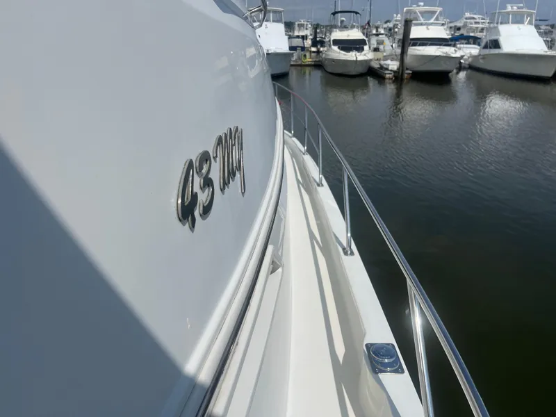 Slide: The Image of 2006 Carver 430 Cockpit Motor Yacht docked in marina, side view. - 15