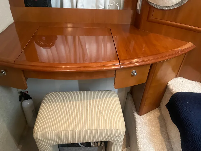 Slide: The Image of Wooden vanity desk with stool in 2006 Carver 430 Cockpit Motor Yacht interior. - 35