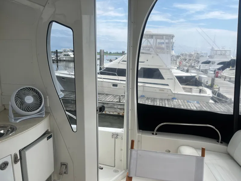 Slide: The Image of Interior view of 2006 Carver 430 Cockpit Motor Yacht at marina. - 6