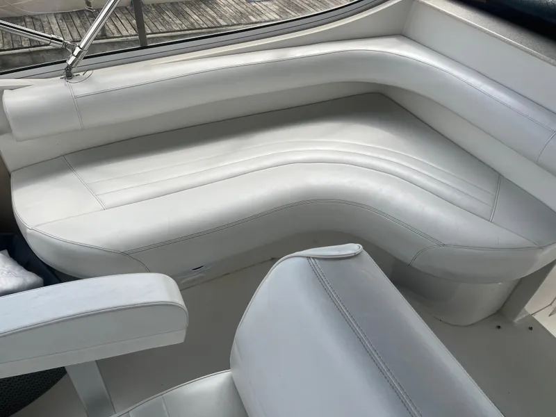 Slide: The Image of Luxurious white seating on 2006 Carver 430 Cockpit Motor Yacht. - 7
