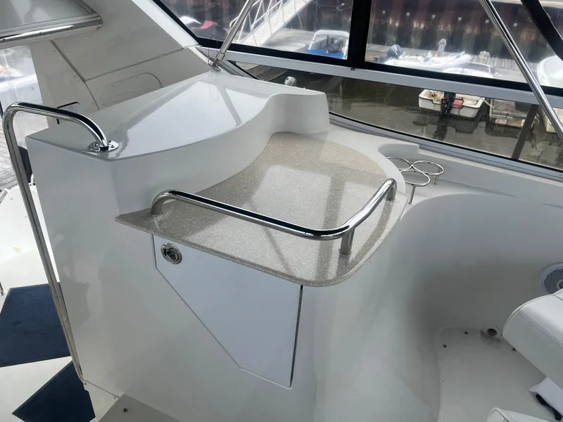 Slide: The Image of 2006 Carver 430 Cockpit Motor Yacht interior with sleek countertop and railing. - 9