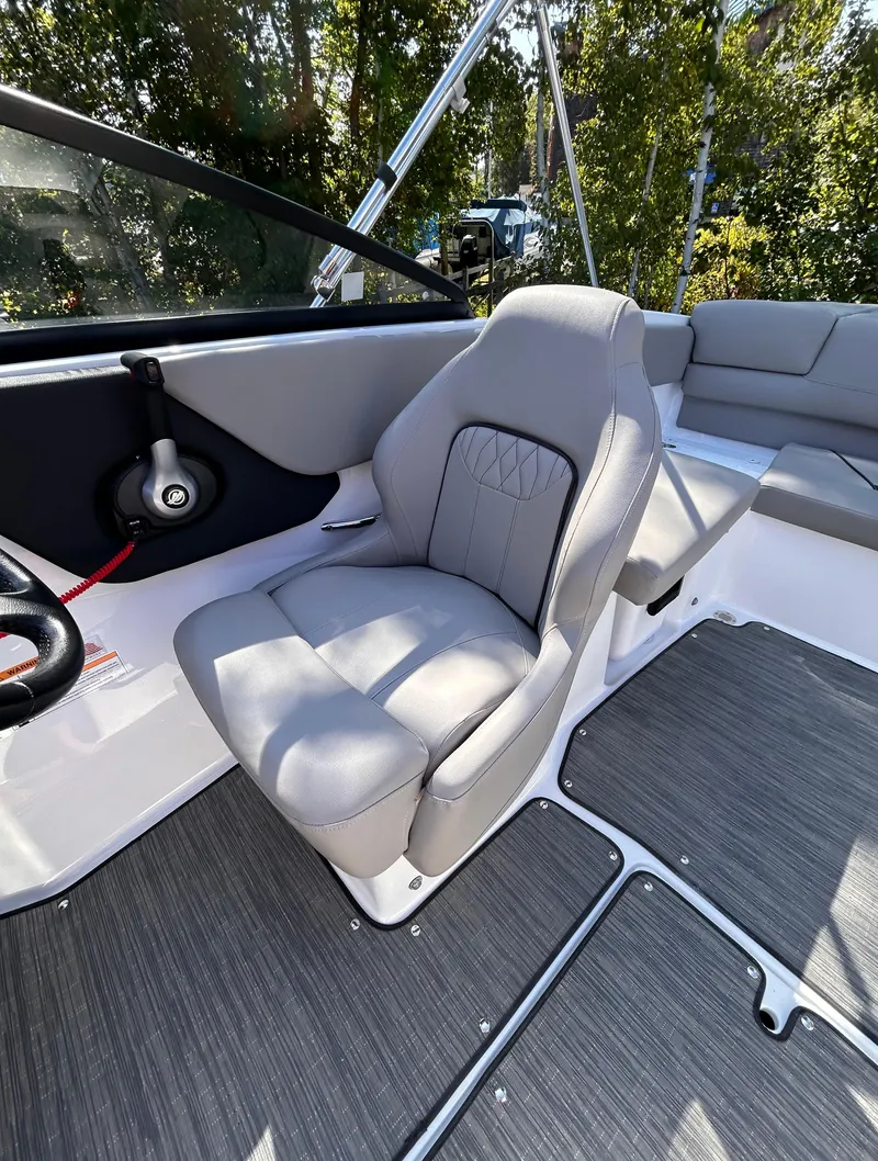 Slide: The Image of 2024 Glastron GX 215 boat interior with gray seating and modern design. - 34
